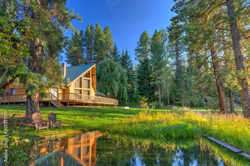 Luxury Cedar cabin home with Large porch, pine trees and pond