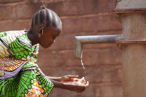 Candid Washing Hands with Fresh Water Climate Change Symbol