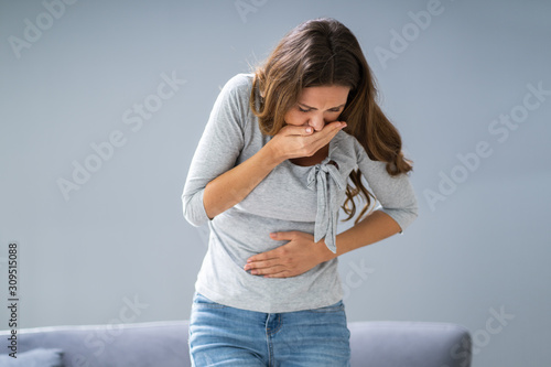 Young Pregnant Woman Suffering From Nausea