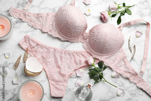 Flat lay composition with women's underwear on marble background