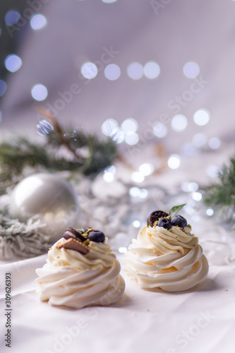 Pavlova's cake. Marshmallows meringue white cream Christmas background bokeh appetizing sweet treats gift home baking pastry shop