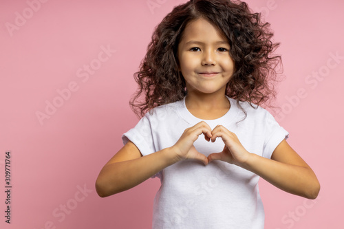 Portrait of a pretty curly little girl