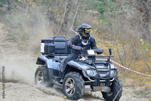 Cool view of active ATV and UTV driving in mud at Autumn