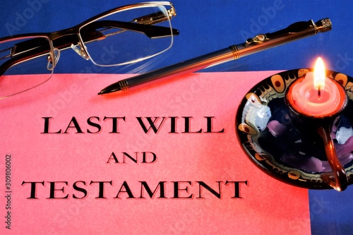 The last will and Testament, an act of unilateral will, is notarized. On the table is a blank document, glasses and a pen for reading and writing, a vintage candle burns out.
