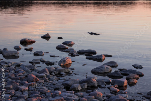 Stones in the water at dusk