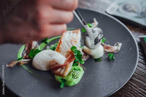 Fish food on plate in michelin star restaurant