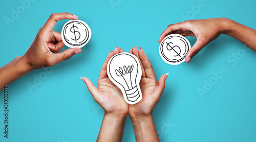 Hands with dollar sign coins and light bulb