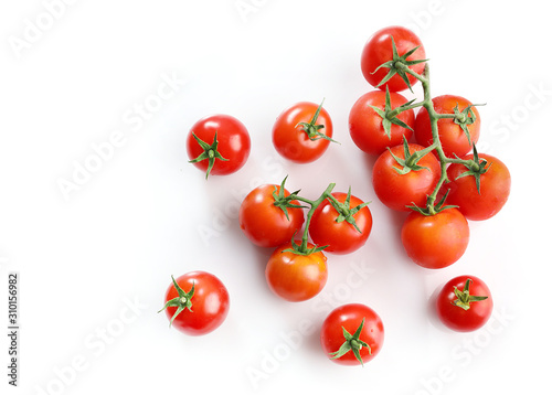 Red ripe cherry tomatoes isolated on white background. Top view
