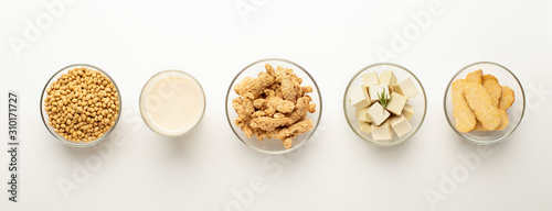 Soybeans, soy milk, soymeat, tofu and tempeh in bowls