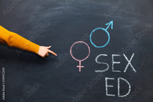 School blackboard with text SEX ED