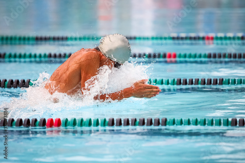 Breaststroke swimmer in a race