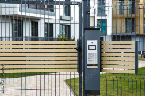 Video intercom on the gate at the entrance to the residential area.