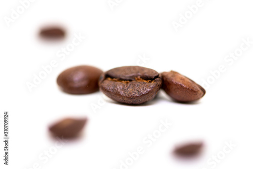 Close up of coffee beans on a white background