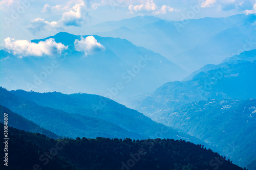 Mountains in blue tone with clouds, travel in India, Himalayas Range, landscape image