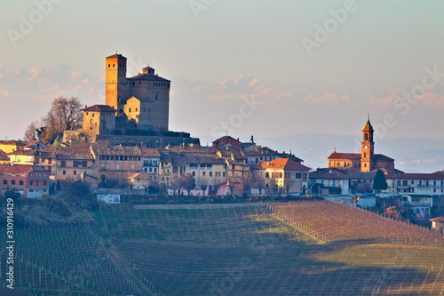 Winter view at golden hour of Serralunga D'Alba village and its castle, in the famus Langhe region, Cuneo, Piedmont, Italy