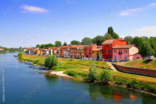 cityscape of pavia in italy with colorful houses on the river in italy