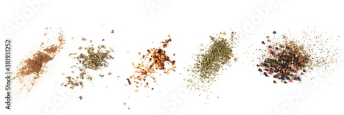 Set cinnamon powder, basil, ground dry chili pepper, parsley, colorful pepper grain and minced, background, top view texture