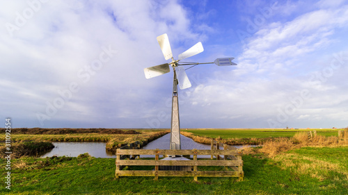 Panoramic Dutch landscape with windmill
