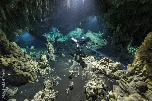 A DPV cave diver swims in the Hatzuts Aktun cenote (Mexico)