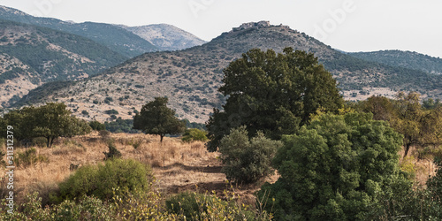 nimrod fortress sits on a peak above the hermon stream nature reserve in the golan heights israel with mt hermon in the left background