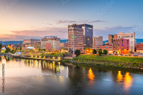 Charleston, West Virginia, USA downtown skyline on the river at dusk.