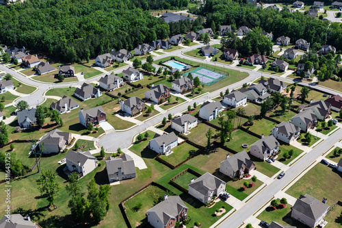 Aerial view of clean suburban cul-de-sac streets and homes in the eastern United States. 