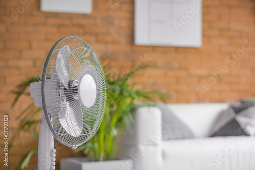 Modern electric fan in room