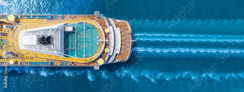 Aerial view of beautiful white cruise ship above luxury cruise close up at stern of cruise sail with contrail in the ocean sea concept smart tourism travel a vacation time on summer, webinar banner