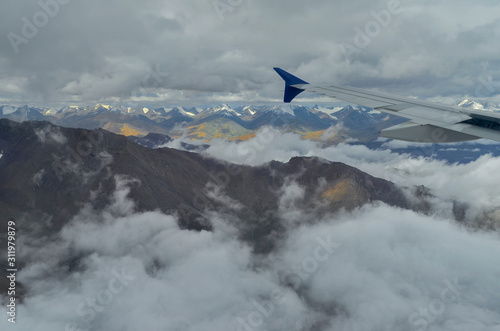 Arial view Snow peaks of himalayas from Flight window, Ladakh, India, Asia