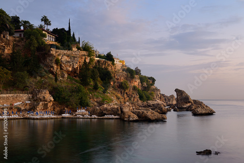 Cliffside resort at dusk on Turkish Riviera at Antalya Kaleici Harbour Turkey