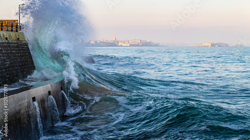 Big wave crushing during high tide in Saint-Malo