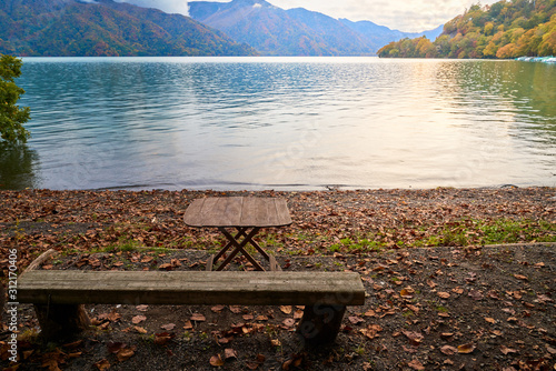 empty wood chair near chuzenji lake in autumn of nikko