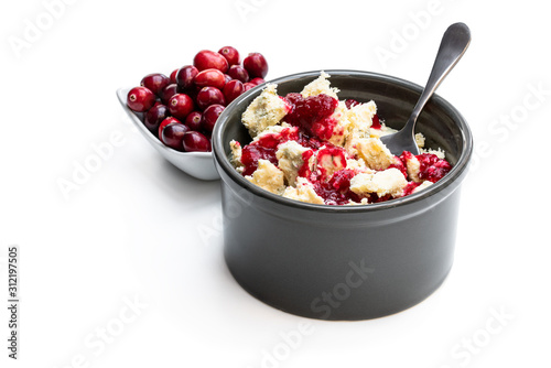 Potted aged Blue stilton cheese with cranberry sauce isolated on white