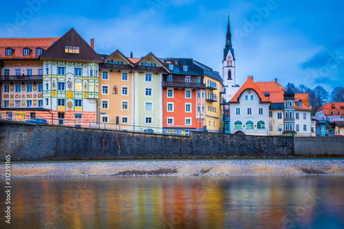 Bad Tolz, Bavaria, Germany - Early Evening View of the Colorful Houses in the Old Town Center of Bad Tolz, with Reflections in the Isar River