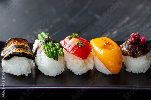 Vegan sushi with tomato, mushroom and aubergine