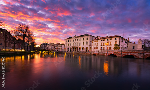 27 december 2019 (Treviso, Italy): Landscape of the University building in Treviso and the river Sile at sunset on Christmas time