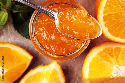 orange homemade jam marmelade in a glass jar. orange marmelade