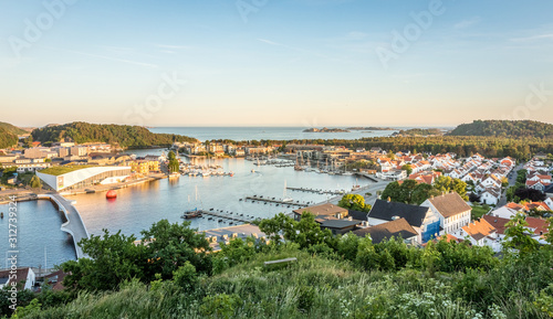 Mandal, a small city in the south of Norway. Seen from a height, with the sea and the sky in the background.