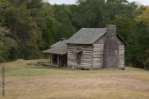 Weathered log cabin with a porch