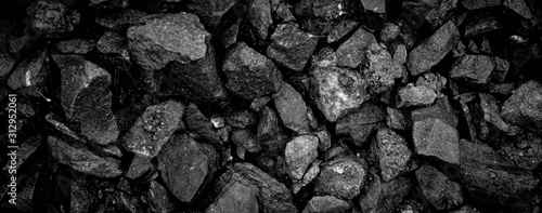 A heap of black natural coal, photo of coal mine background, texture