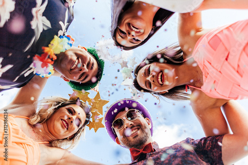 Brazilian Carnival. Group of Brazilian people in costume celebrating the carnival party in the city