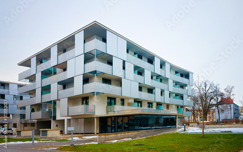 Apartment in residential building exterior. Housing structure at blue modern house of Europe. Rental home in city district on summer. Architecture for business property investment, Salzburg Austria.