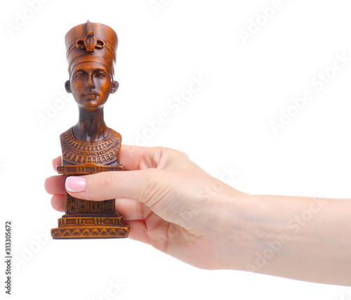 Egyptian Pharaoh figurine in hand on white background isolation