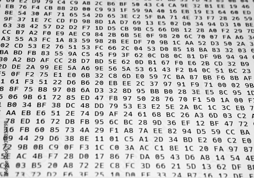 Hex code on computer screen closeup. Random hexadecimal code stream. Concept of hacking, internet security, malware and reverse engineering. Abstract digital data element.