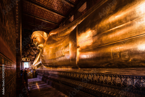 famous golden reclining buddha statue at wat pho bangkok thailand