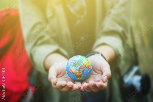 Hands holding vintage globe,a missions concept.