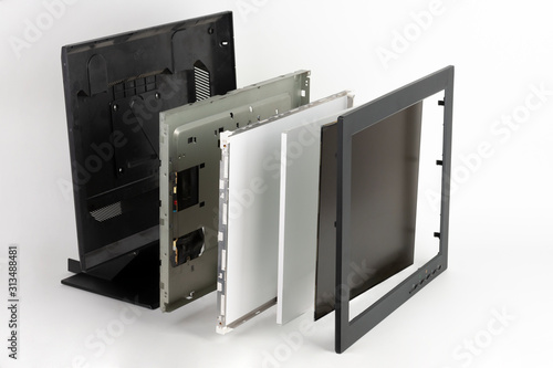 Several parts of LCD monitor, plastic frame, panel consists of polarizing filters, glass and liquid-crystal display, organic glass, reflective layer, metal frame wih circuit boards, plastic frame