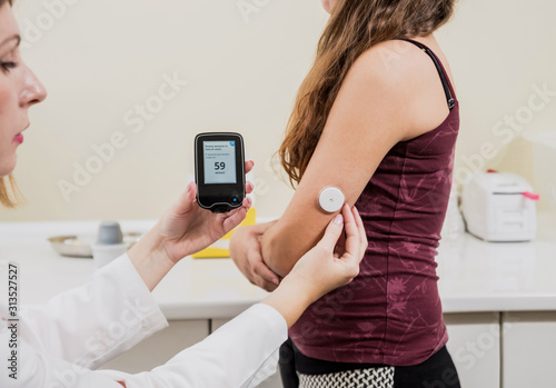 Medical device for glucose check. Continuous glucose monitoring pod. Modern wireless technology.