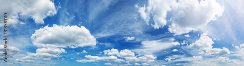 white fluffy clouds on blue sky in summer