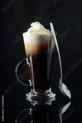 Irish coffee on a black background.